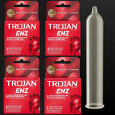 Four boxes of Trojan ENZ Condoms Without Lube are arranged in a grid with a single unwrapped condom displayed vertically on the right. Each box is red and gold, highlighting the product's classic reservoir end and promising enhanced sensitivity for an improved experience.